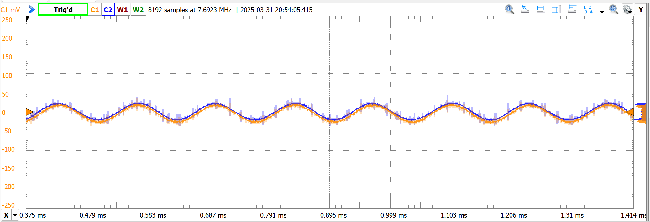 Oscilloscope trace comparing the doubled output (blue) against a clean reference sinusoid at 7.45 kHz (orange). The two waveforms overlap closely across the screen, visually almost the same curve.